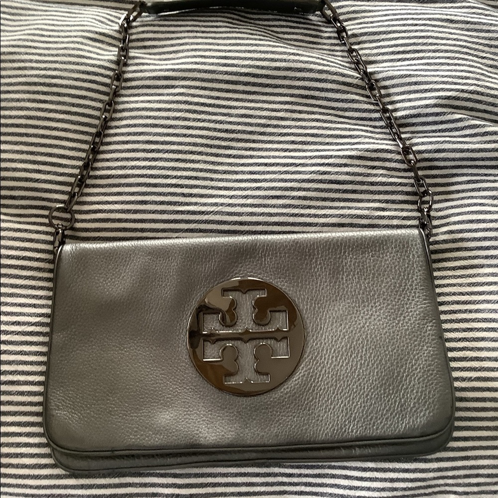 Gorgeous metallic gray, Tory Burch clutch bag. Strap is removable